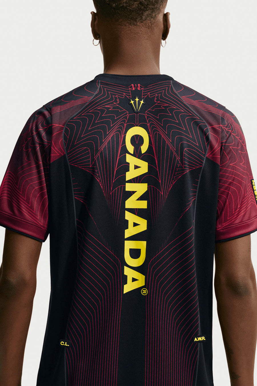 Nike NOCTA x Canada Short Sleeve Top in Black/University Red/Sonic Yellow - Notre